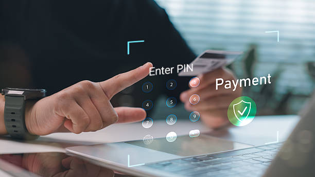 istock Close-up of a man entering PIN code for secure online payment using credit card and digital interface. Concept of fintech, cybersecurity, and digital banking. 2223406416
