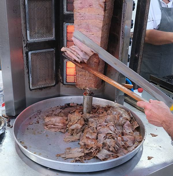 istock Turkish food: Doner kebap being cut for serving 2223408453
