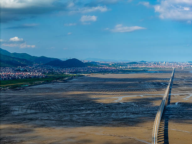 Aerial View of a Long Bridge Over a Dry Riverbed