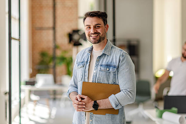 istock Professional working in a Scandinavian style office engaging in planning and teamwork on a project during the day 2223411461