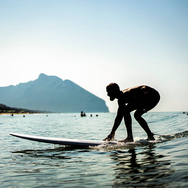 Surfer's board coming out of the wave