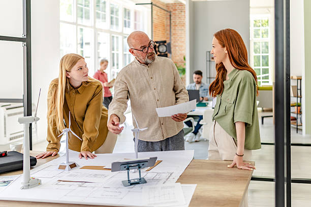 istock Collaboration among professionals in a Scandinavian style office showcasing teamwork and innovative ideas 2223415041