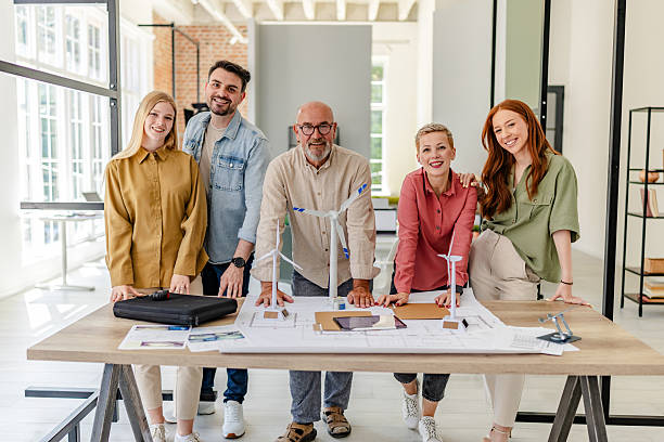 istock Collaboration in a Scandinavian style office with a diverse team working on innovative projects 2223416140