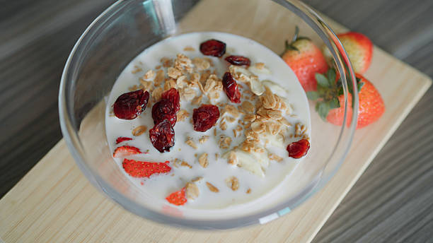 Fruit salad bowl with milk