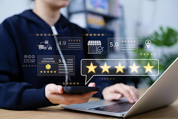 istock Customer review and satisfaction feedback concept. Person using phone and laptop with five-star ratings, review scores, satisfaction icons representing online feedback, reviews, customer analytics, 2223416647