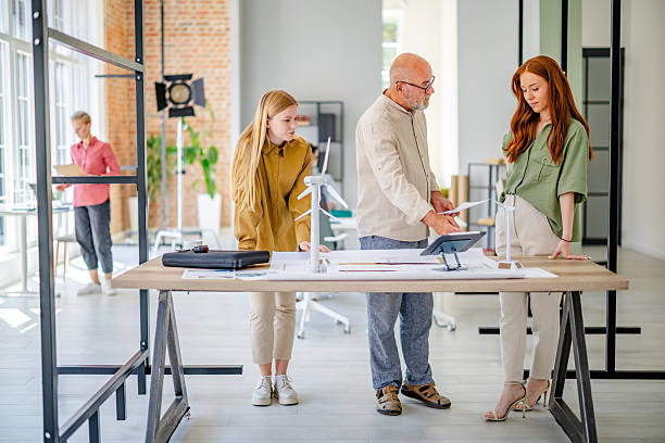 istock Collaboration in a modern Scandinavian office with professionals discussing ideas and plans 2223419238