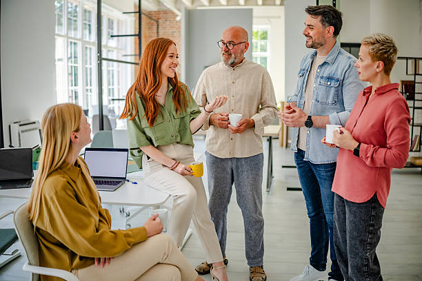 istock Collaboration in a Scandinavian style office with professionals engaged in discussion and sharing ideas 2223421082