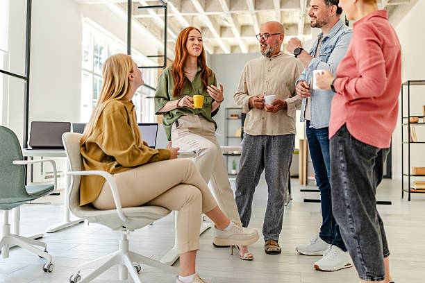 istock Collaborative brainstorming session in a modern Scandinavian style office with diverse professionals engaged in discussion 2223421761