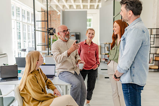 istock Collaborative teamwork in a modern Scandinavian office environment with professionals sharing ideas 2223423806
