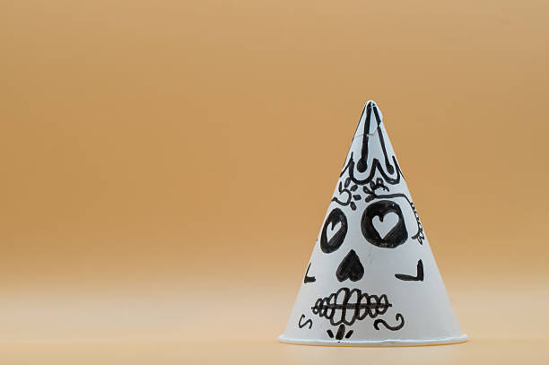 Paper cones drawn as Catrina from Mexico's Day of the Dead