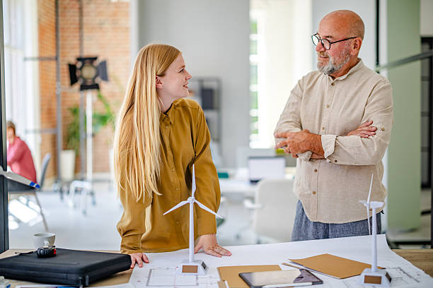 istock Discussion on renewable energy concepts in a modern Scandinavian style office setting during a business meeting 2223424596