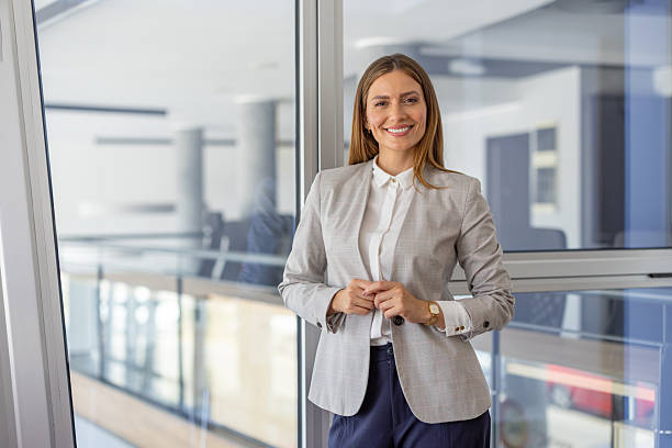 istock Confident businesswoman standing in modern office 2223425100