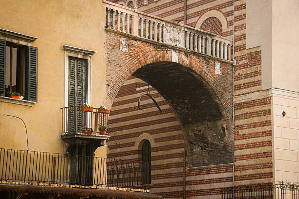 The hanging whale rib bone under Arco della Costa in Verona, Italy.