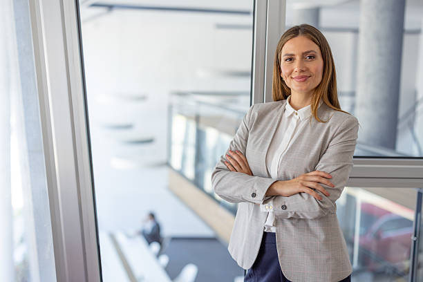 istock Confident businesswoman standing in modern office 2223425159
