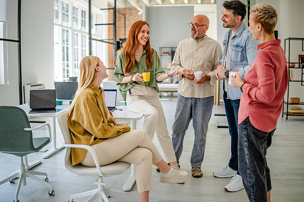 istock Team collaborates in a modern Scandinavian office, sharing ideas and inspiring each other during a productive business meeting 2223426633