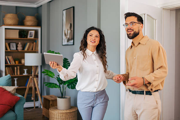 istock Real estate agent showing modern apartment to client 2223426654