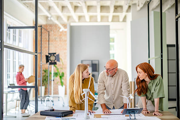istock Team collaborates in modern Scandinavian office to brainstorm ideas and develop strategies for innovative business plans 2223426672