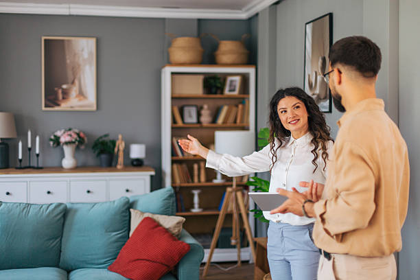istock Real estate agent showcasing modern living room 2223426742