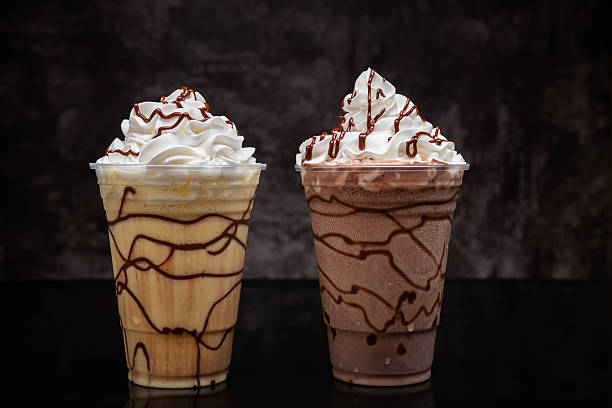 istock Milkshakes of different flavors on a dark background. 2223429090