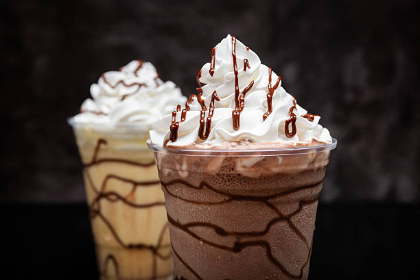 istock Milkshakes of different flavors on a dark background. 2223429095