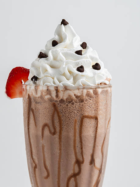 istock Chocolate milkshake served in a clear glass on a white background. Isolated drink. 2223429120