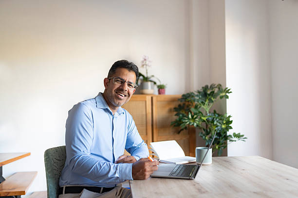 istock Businessman working on laptop at home 2223432538