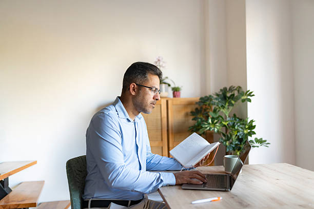 istock Entrepreneur working on laptop at home 2223432544