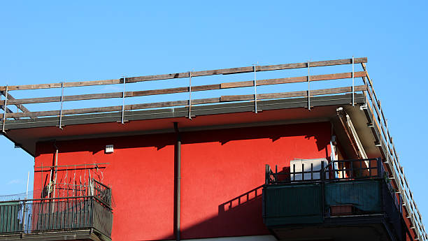 istock installed safety barrier for workers safety to prevent falls during maintenance work on the roof of the condominium without people 2223432780