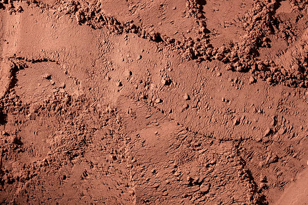 istock Natural dark brown cocoa powder textured background, closeup, top view 2223434985