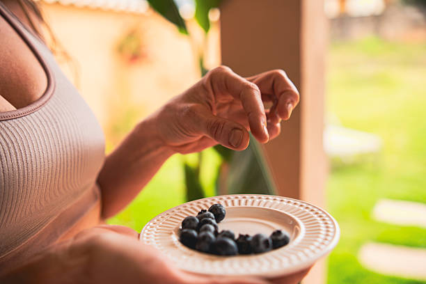 Woman Enjoying Blueberry Snacking Moments
