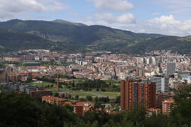 istock Bilbao cityscape with mountain backdrop. 2223436844