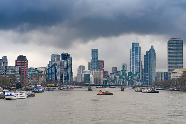 London, United Kingdom. January 31st, 2025.\nHeavy clouds over a panorama view of the city of London with offices and tall buildings, offices and hotels, seen from Westminster Bridge over the River Thames. London, UK.