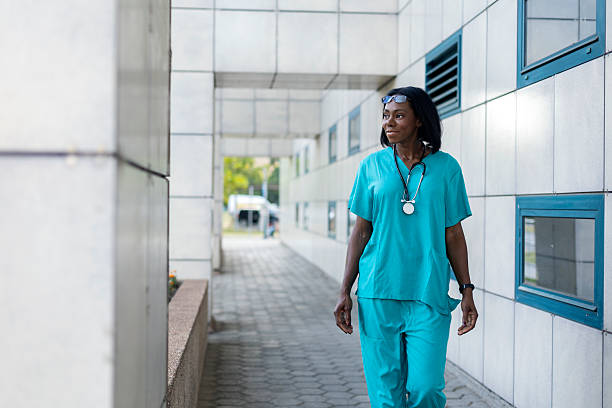istock Female doctor walking outside 2223437742