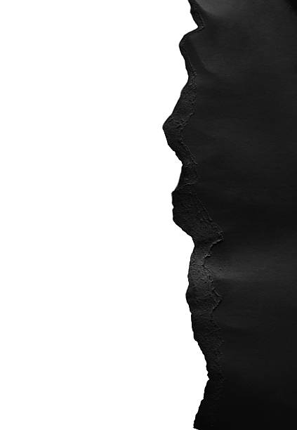 istock Black sheet of paper with a realistic torn paper edge on white background 2223442052
