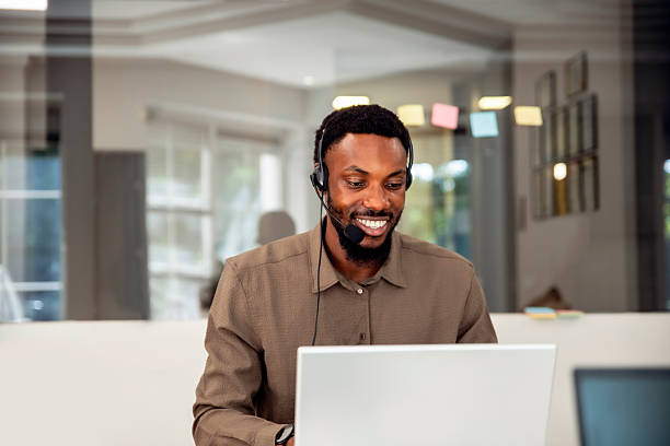 Sales man and consulting, support or advice with headset and laptop