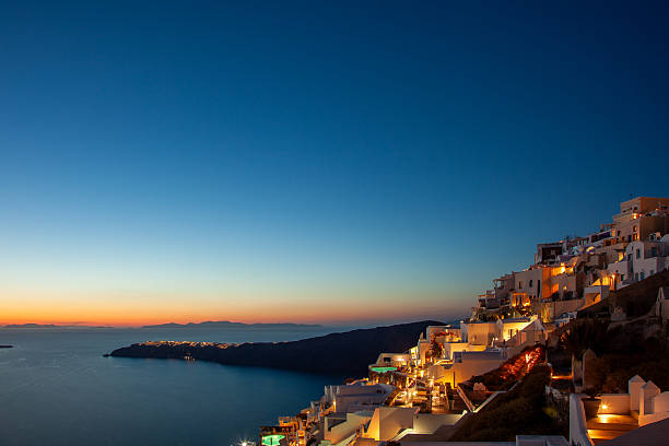 istock Santorini Sunset from a cliff top view 2223443223
