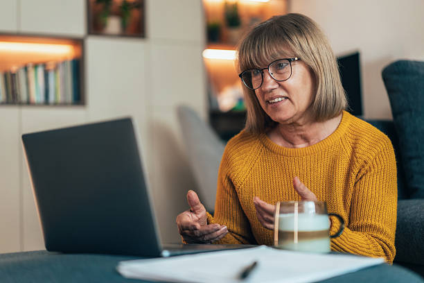 istock Senior woman having video call 2223443453