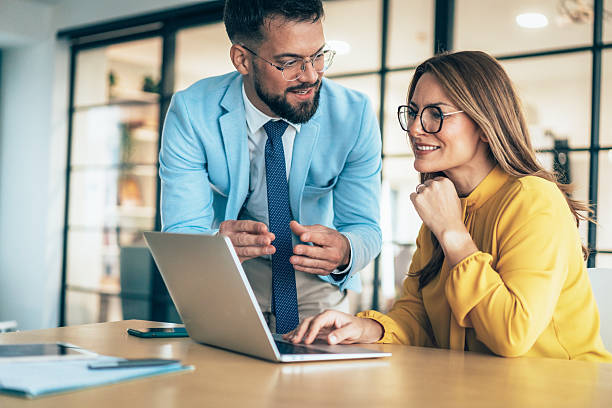 istock Two business coworkers talking 2223443467
