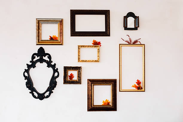 istock Wall display of empty frames with autumn leaves in a cozy interior setting 2223444685