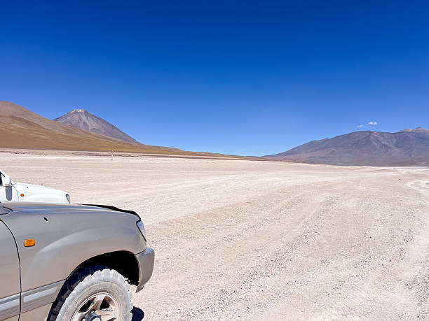 istock Off-Road Vehicle in Desert Landscape with Mountains 2223445188
