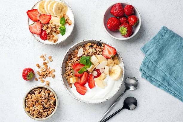 istock Granola and yogurt bowl with fruits 2223447598