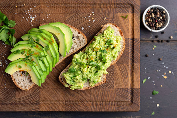istock Avocado toasts on a wooden board 2223448195