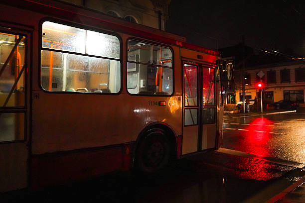 Old and creepy looking public transport bus at night with moody and spooky colors, Vilnius, Lithuania