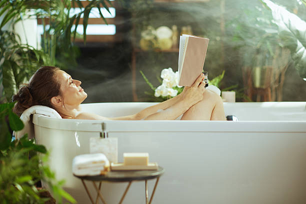 istock Peaceful Bath Reading in a Steamy Bathroom 2223452727