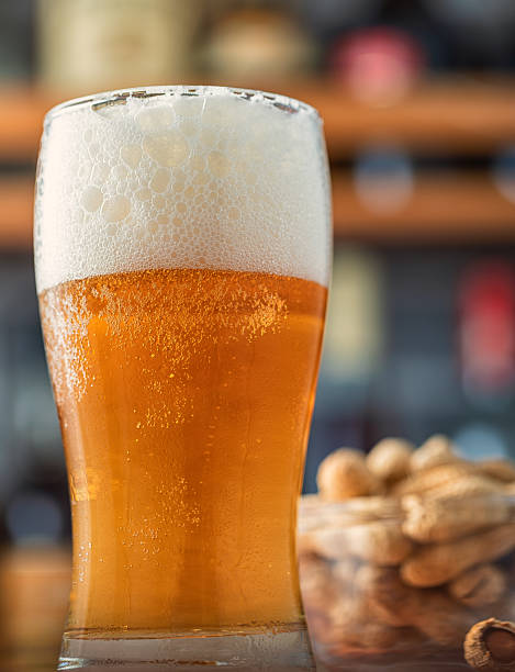 istock Pint of beer on a wooden table 2223452835