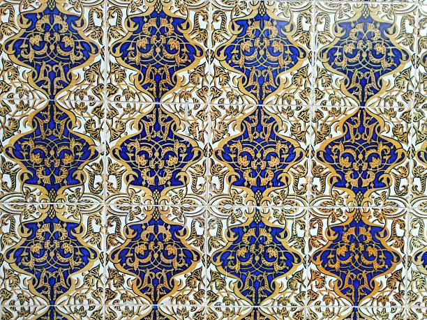 Intricate Gold and Green Portuguese Azulejo Tile Pattern - Full-frame image of a traditional Portuguese Azulejo tile pattern in gold, ochre, brown, and green with symmetrical star and geometric floral motifs, perfect for background use.