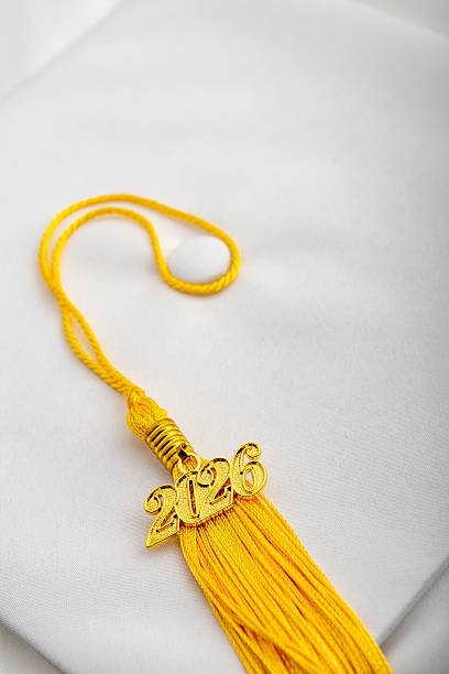 istock 2026 Graduation Charm on Yellow Gold Tassel on Grad Cap 2223453564