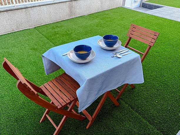 istock Table for couple dining in the garden on a summer evening 2223458626
