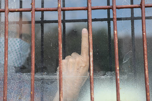 A powerful series of close-up images depicting hands interacting with metal fences and bars. From gripping rusty prison bars to reaching toward distant freedom, these images explore themes of confinement, emotional isolation, human resilience, and the struggle for liberation. Suitable for concepts of imprisonment, social justice, mental health, and personal transformation.