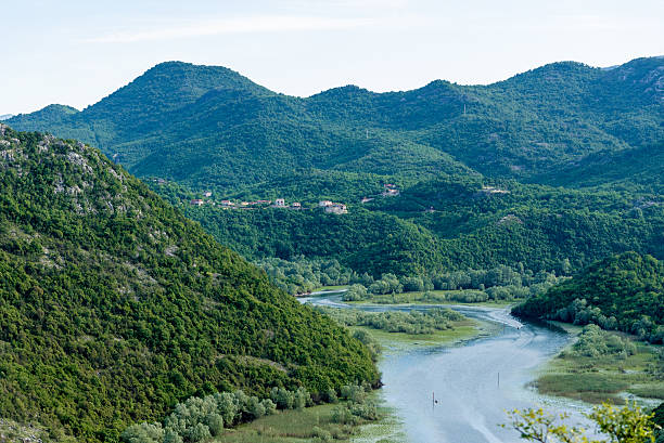The Crnojevica River flows into Lake Skadar, summer mountains Montenegro landscape